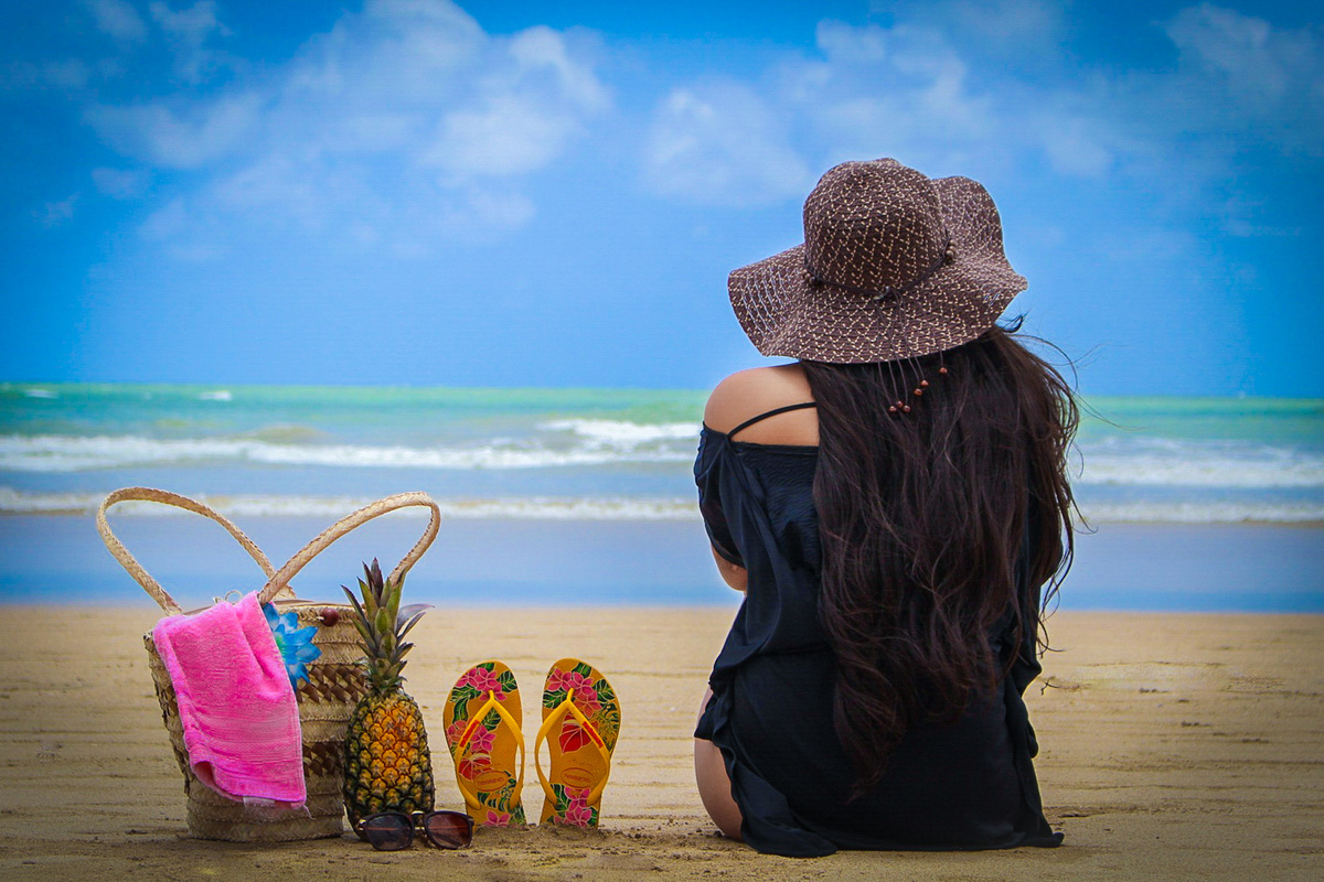 Photo of Woman Sitting on Beach